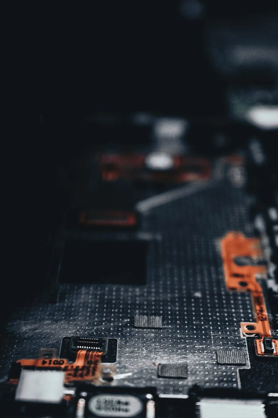 Electronic components and connections on a dark circuit board